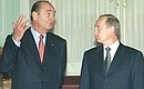 President Putin with French President Jacques Chirac at a document-signing ceremony.