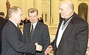 Vladimir Putin meeting with the participants in the All-Russia Congress of Ukrainians Living in Russia. Vladimir Putin with People\'s Artist of Russia Alexei Petrenko.