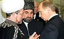President Putin with Magomed-Khadzhi Albogachiyev, the Mufti of the Republic of Ingushetia and Chairman of the Muslim Coordinating Centre in the North Caucasus (centre), and Mufti Talgat Tadzhuddin, head of the Muslim Council of Russia and the European CIS countries, at a reception to mark the 57th anniversary of victory in the Great Patriotic War.