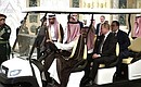 Before the beginning of Russian-Saudi talks. With King Salman bin Abdulaziz Al Saud of Saudi Arabia.