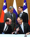 Russian Foreign Minister Sergei Lavrov (bottom right) and Chilean Foreign Minister Alfredo Moreno signed Russian-Chilean Partnership Agreement in the presence of Dmitry Medvedev and President of Chile Sebastian Pinera (top left).
