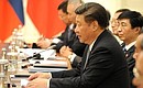 В ходе встречи с Председателем КНР Си Цзиньпином.