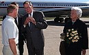 President Putin at the Sochi Airport with former US President George Bush senior and his spouse, Barbara.
