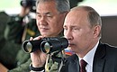 During the military exercises being held as part of the comprehensive troop inspection in the Eastern Military District. With Defence Minister Sergei Shoigu.