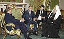 С премьер-министром Италии Сильвио Берлускони (слева) и Патриархом Всея Руси Алексием Вторым (справа).