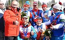 With Russia’s National Paralympic Committee President Vladimir Lukin and Russian athletes Roman Petushkov, Vladislav Lekomtsev, Grigory Murygin and Rushan Minnegulov (left to right) who won gold medals in the open relay event at the Sochi Paralympics. Photo: RIA Novosti