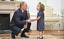 Vladimir Putin met with heart transplant patient Vera Smolnikova aged four.