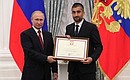 A letter of recognition for contribution to the development of Russia football and high athletic achievement is presented to Russia national football team player Alexander Samedov.