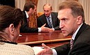Before the meeting on economic issues. Deputy Prime Minister Igor Shuvalov (right), Prime Minister Vladimir Putin (background on the right), and Chief of Staff of the Presidential Executive Office Sergei Naryshkin.