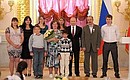 Presenting the Order of Parental Glory to Antonina and Ivan Ryabov, who are raising 13 children.