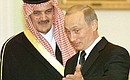 President Vladimir Putin meeting with Saudi Foreign Minister Saud al-Faisal bin Abdul-Aziz al-Saud.