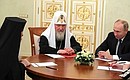 At a meeting with Patriarch Kirill of Moscow and All Russia and Patriarch Theophilos III of Jerusalem and All Palestine.