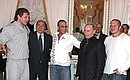 From left to right: with participant in the mixed martial arts tournament Alexander Yemelyanenko, former Italian Prime Minister Silvio Berlusconi, actor Jean-Claude Van Damme, and absolute mixed-style world champion Fyodor Yemelyanenko.
