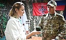 Maria Lvova-Belova presented the first Defender of Family and Children badges to soldiers in the Donetsk People’s Republic. Photo by the press service of the Presidential Commissioner for Children's Rights