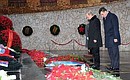 Laying a wreath at the Eternal Flame in the Hall of Military Glory on Mamayev Hill.