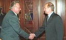 Vladimir Putin with Gennady Raikov, the leader of People\'s Deputy group.
