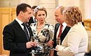 At a reception marking Vladimir Putin’s inauguration as President of Russia. Left to right: Dmitry Medvedev, Svetlana Medvedeva, Vladimir Putin and Lyudmila Putina.