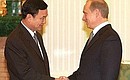 С Премьер-министром Таиланда Таксином Чинаватом. 