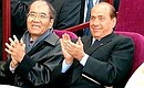 Italian Prime Minister Silvio Berlusconi and UNESCO Director General Koichiro Matsuura attending a concert during the opening of the Constantine Palace in Strelna.