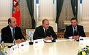 Meeting with the foreign and defence ministers and the secretaries of the Security Councils of the Collective Security Treaty Organisation member countries.Next to the President are Russian Security Council Secretary Igor Ivanov (left ) and Russian Deputy Prime Minister — Defense Minister Sergei Ivanov.