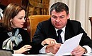 Economic Development Minister Elvira Nabiullina and Defence Minister Anatoly Serdyukov at a meeting on wage reform for armed forces and law enforcement personnel.