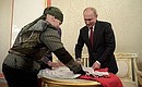 Vladimir Putin has signed a sambo training outfit for Kolya.