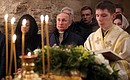Vladimir Putin attends Christmas mass at St Nicholas Church on Lipno island.