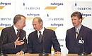 Joint stand of Germany\'s leading natural gas distributor Ruhrgas AG and Russian Gazprom: President Vladimir Putin, Ruhrgas AG board chairman Burkhard Bergman (left) and Gazprom board chairman Alexei Miller, Messe Dusseldorf exhibition complex.