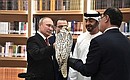 Vladimir Putin presents a white gyrfalcon to Crown Prince of Abu Dhabi and Deputy Supreme Commander of the UAE Armed Forces Mohammed bin Zayed Al Nahyan.