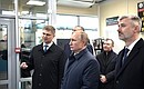 Vladimir Putin familiarizes himself with the information on the development of transport infrastructure in the south of Russia, in particular the Crimean Railway.