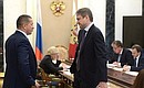 Deputy Prime Minister and Presidential Plenipotentiary Envoy to the Far Eastern Federal District Yury Trutnev and Agriculture Minister Alexander Tkachev before the meeting with Government members.