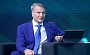 Sberbank CEO German Gref during the main discussion at the AI Journey 2021, the international conference on artificial intelligence and data analysis. Photo: TASS