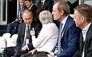 At the Russian round of the Formula 1 world championship. From left to right: Vladimir Putin, Formula 1 President Bernie Ecclestone, Honorary Member of the International Olympic Committee Jean-Claude Killy, and President of the International Ice Hockey Federation Rene Fasel.