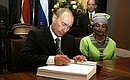 President Vladimir Putin signed the South African parliament\'s guest book.