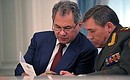 Before the start of a meeting with senior Defence Ministry and Security Council Staff officials. Defence Minister Sergei Shoigu (left), and chief of Armed Forces General Staff Valery Gerasimov.