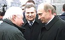 A wreath-laying ceremony at the Obelisk to Soviet Soldiers. President Putin with Polish President Alexander Kwasniewski during a meeting with Russian and Polish veterans.