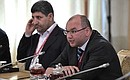 Managing Director of IRNA news agency Seyyed Zia Hashemi (left) and TASS Director General Sergei Mikhailov at a meeting with heads of the world's leading news agencies.