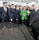 At the Russian pavilion at the Hannover Messe 2013. With German Federal Chancellor Angela Merkel.
