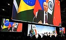 BRICS leaders, including Vladimir Putin, who joined in via videoconference, made statements for the media. Photo: Sergei Bobylev, TASS