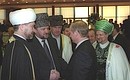 A party after the inauguration ceremony. Vladimir Putin with Ravil Gainutdin, head of the Council of Muftis of Russia (left), Akhmat Khadji Kadyrov, head of the Spiritual Directorate of the Muslims of the Chechen Republic (second left), and Mufti Talgat Tadzhuddin, head Central Spiritual Directorate of the Muslims of Russia (right).