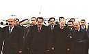 President Putin and Greek President Konstantinos Stephanopoulos (right) at the airport.