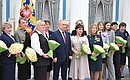 Group photo following the ceremony for presenting state decorations on International Women’s Day. Photo by Iliya Pitalev (”Rossiya Segodnya“)