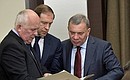 Before a meeting with Defence Ministry leadership and defence industry heads. Right to left: Deputy Prime Minister Yuri Borisov, Industry and Trade Minister Denis Manturov and Rostec CEO Sergei Chemezov.