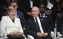 C Федеральным канцлером Германии Ангелой Меркель на пленарном заседании Парижского форума мира.
