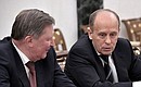 Special Presidential Representative for Environmental Protection, Ecology and Transport Sergei Ivanov (left) and Director of the Federal Security Service Alexander Bortnikov before the meeting with permanent members of the Security Council.