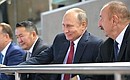 На соревнованиях чемпионата мира по дзюдо. Слева направо: Президент Монголии Халтмагийн Баттулга, Президент России Владимир Путин и Президент Азербайджана Ильхам Алиев.