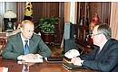 С председателем правления Внешэкономбанка Андреем Костиным.