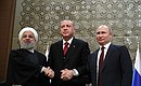 News conference following a meeting of the presidents of Russia, Turkey and Iran. With President of Iran Hassan Rouhani (left) and President of Turkey Recep Tayyip Erdogan.