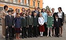 President Putin with children who contributed their art to the exhibition, “St Petersburg through Children\'s Eyes.”