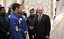 Vladimir Putin briefly talks with the team of UAE astronauts.